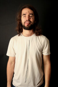 Jacob with X's over his eyes and a black line down his shirt