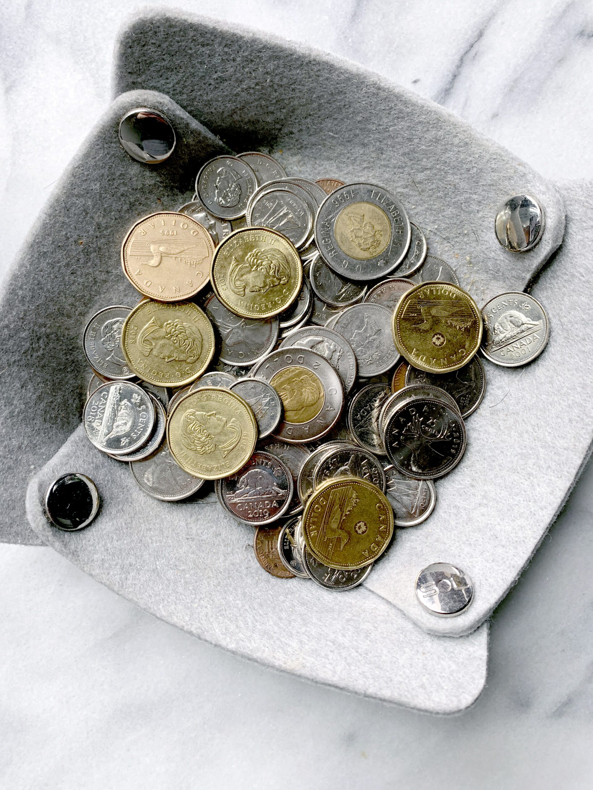a felt bowl of coins