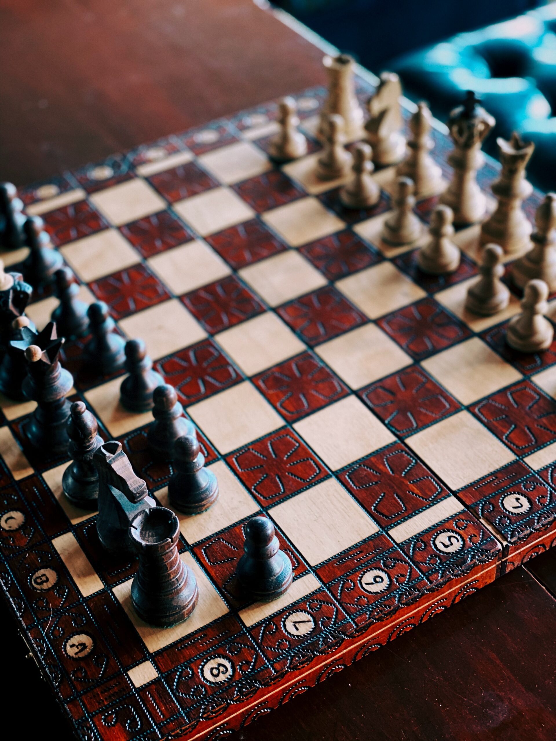 a chess board with black pieces on the left, and white pieces on the right