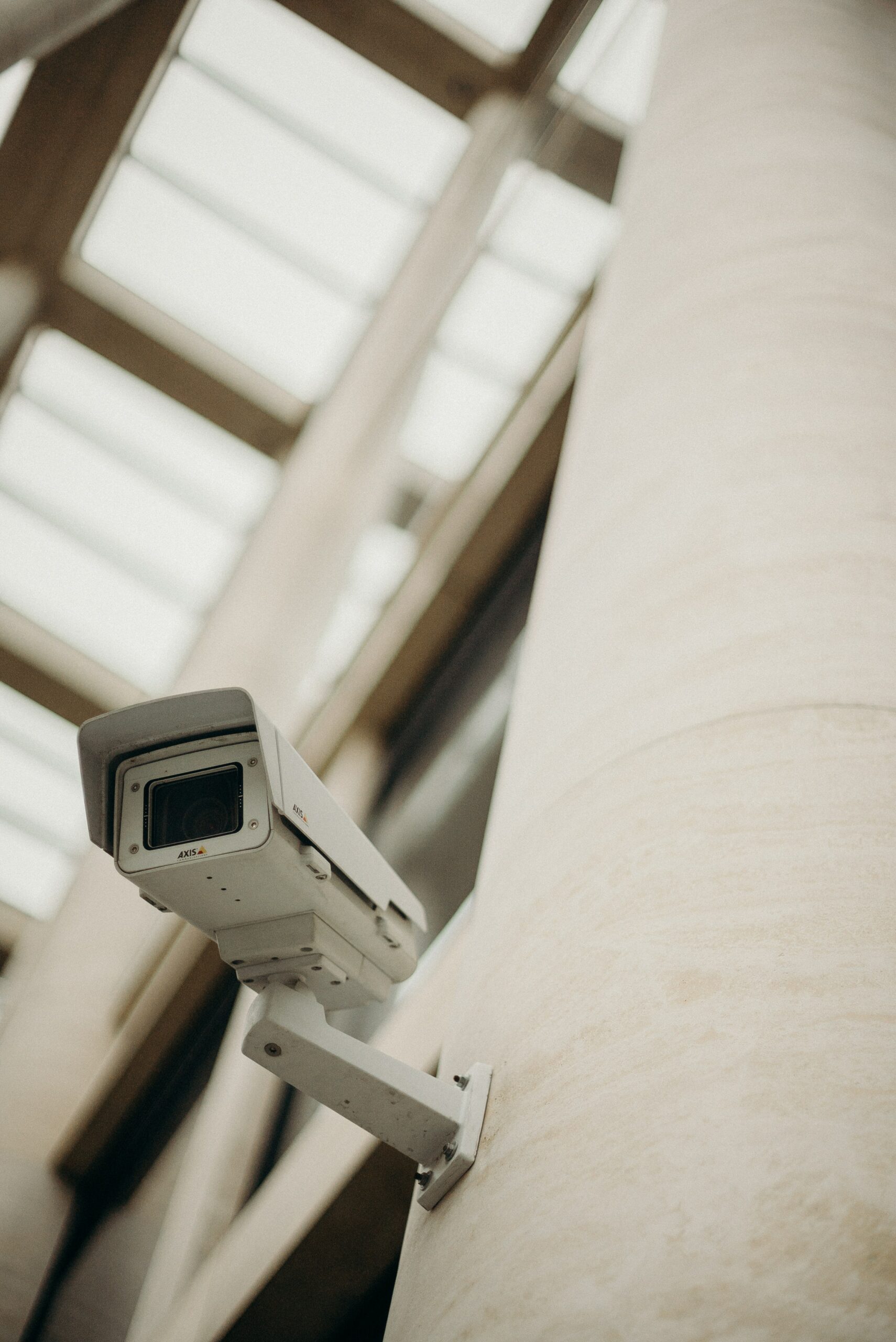 a security camera inside on a concrete wall
