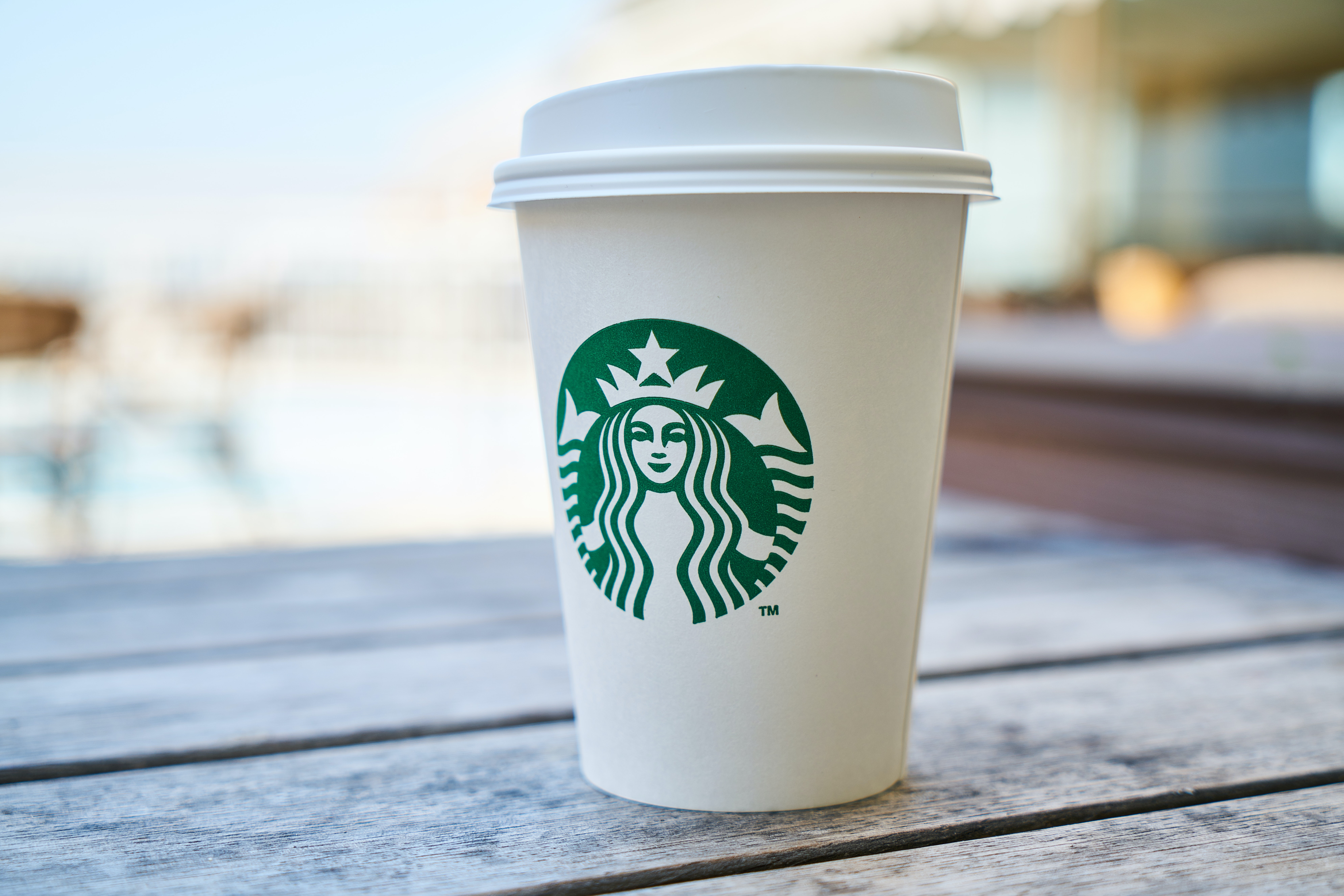 a white Starbucks cup outside
