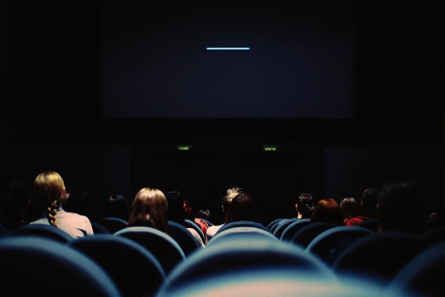 A crowd of people in a movie theatre
