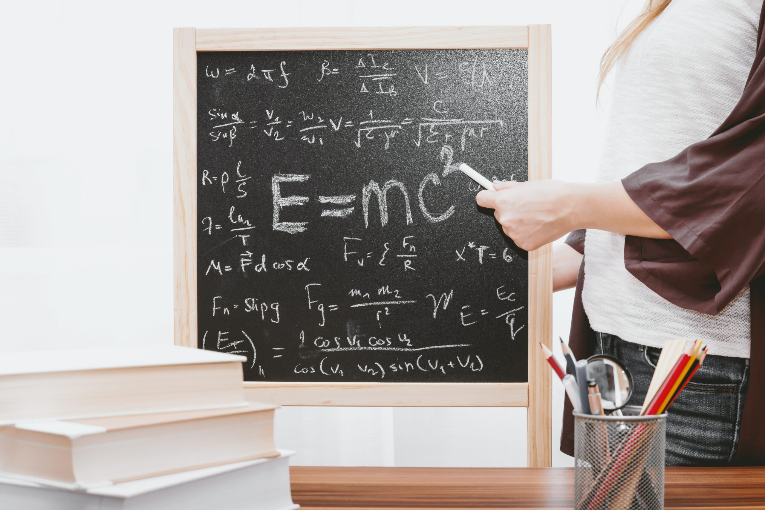 A chalkboard with E=MC squared written on it