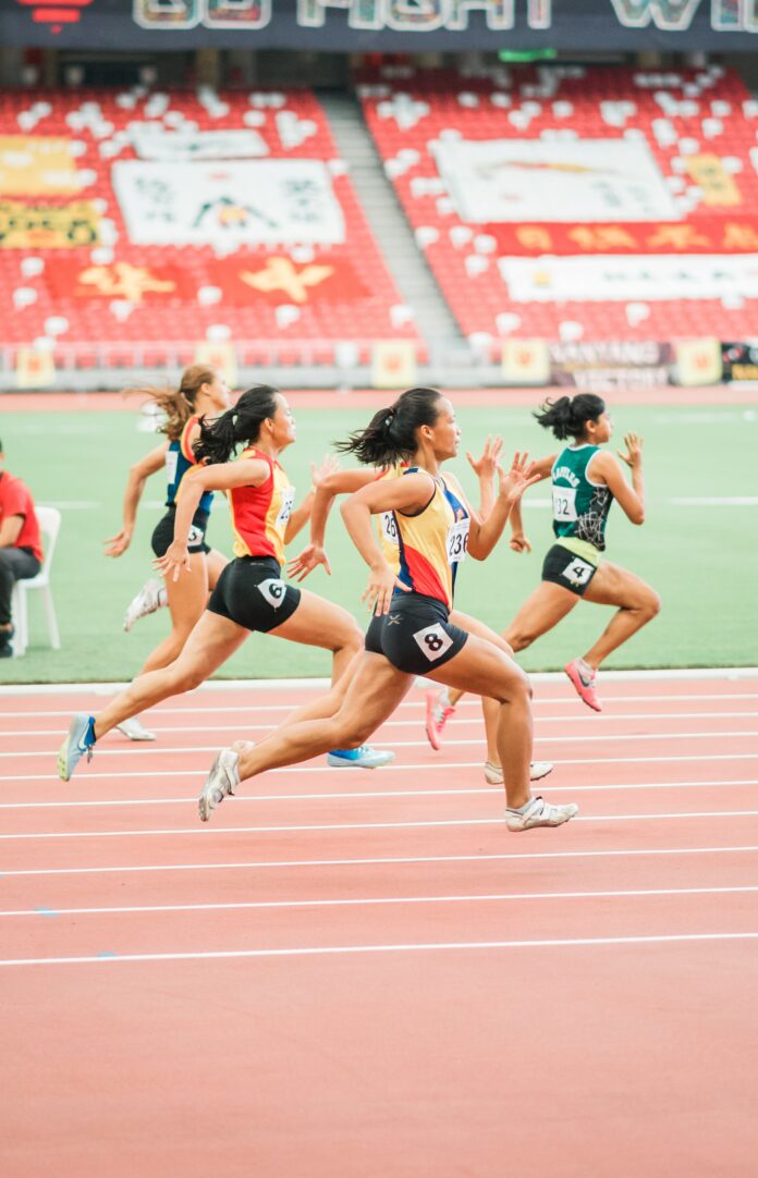jonathan-chng-3R4vPrSB1c4-unsplash (2) Shot of runners sprinting during a race. One runner has a clear advantage.