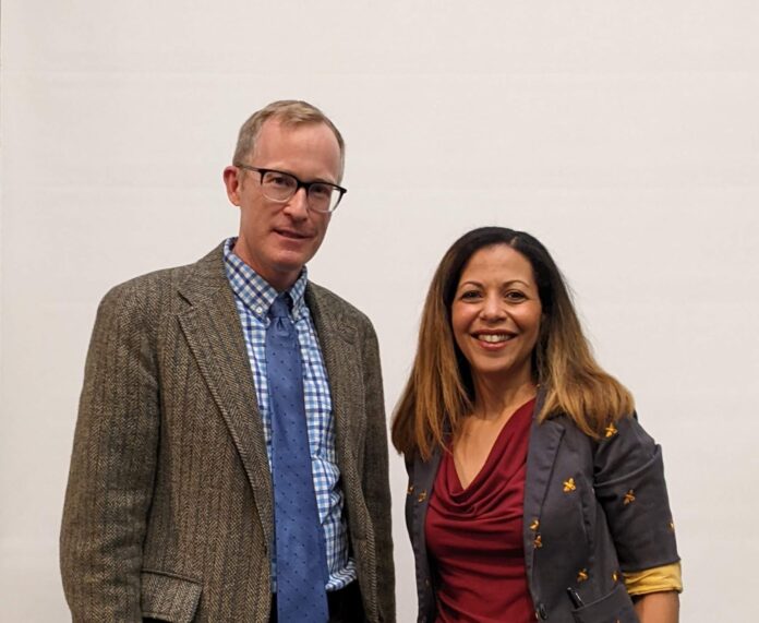 Two people standing next to each other, Dr. Thompson is on the right. Dr. Jeremy Brown of the history department is on the left.
