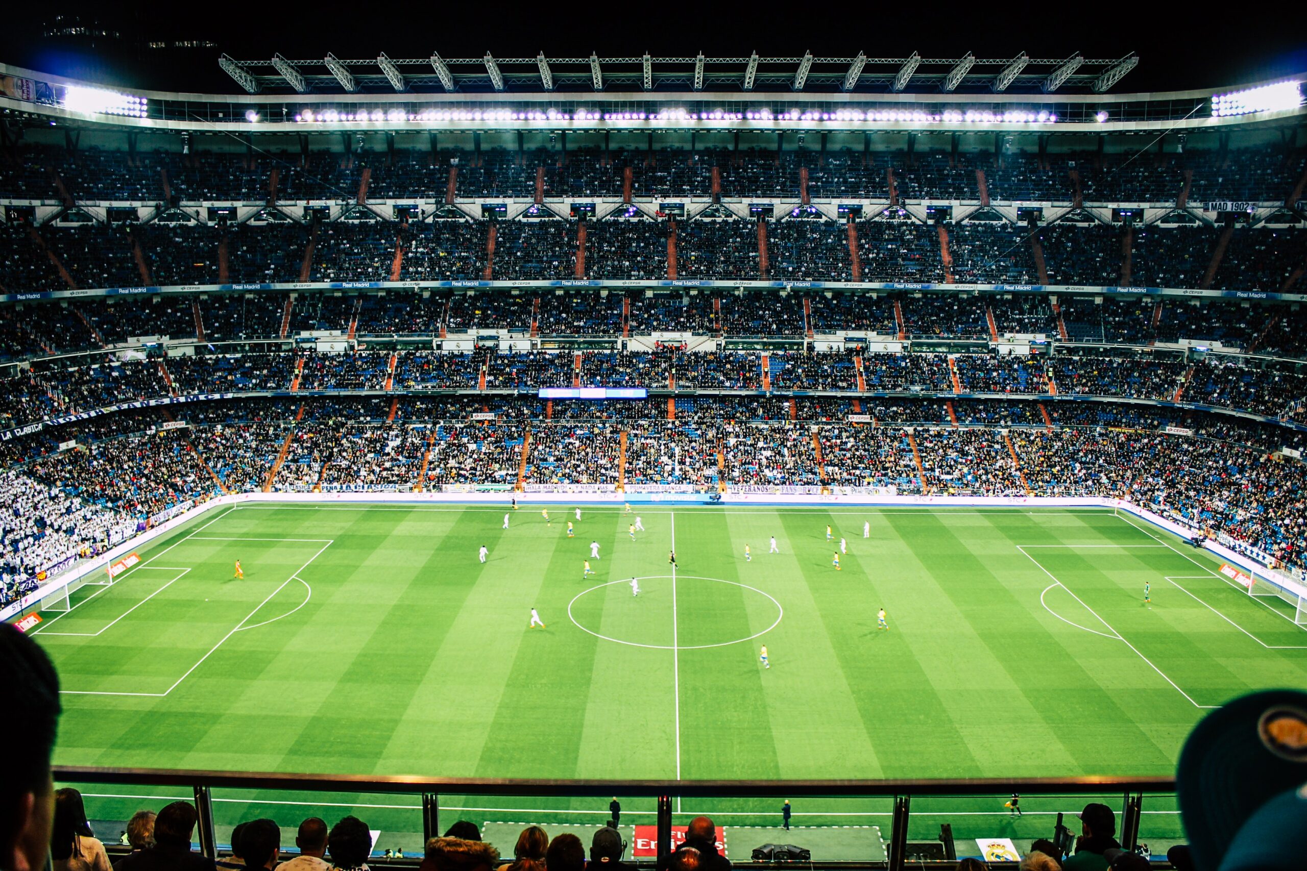 A wide angle shot of a soccer game full of fans