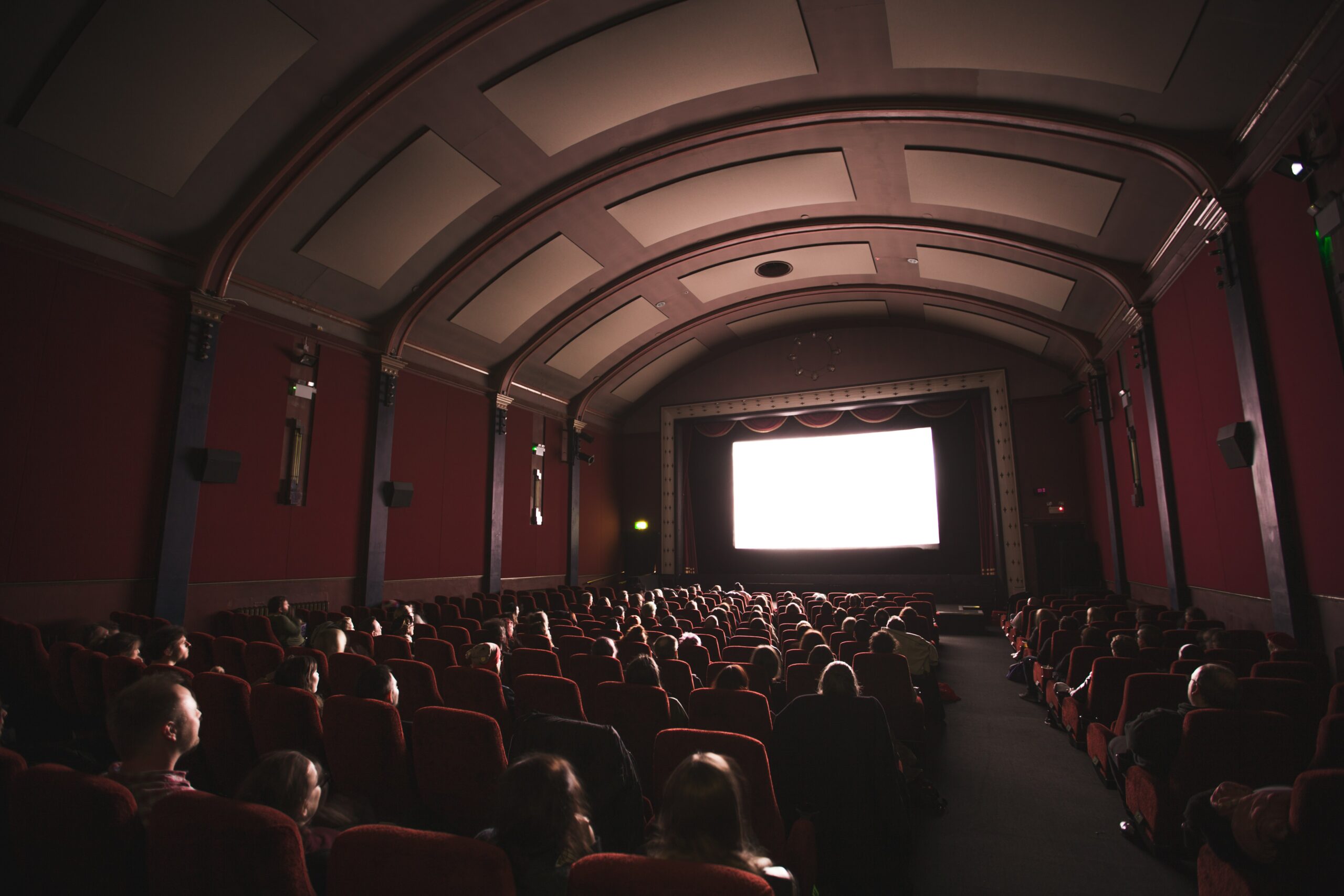 A full movie theatre watching a blank projection