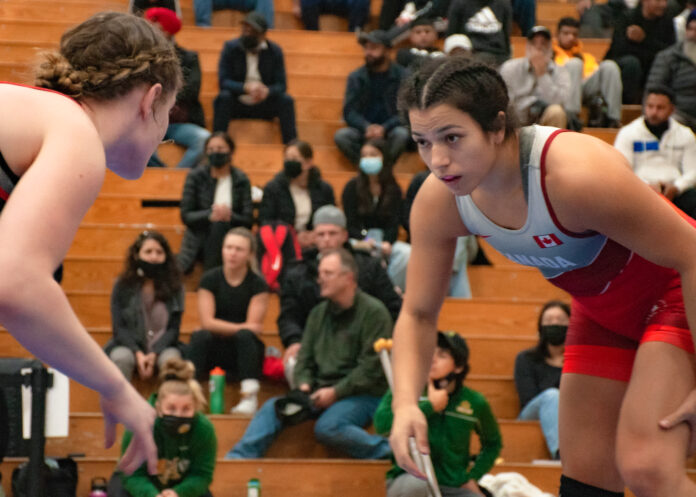 justina Justina Di Stasio wrestling in front of an audience