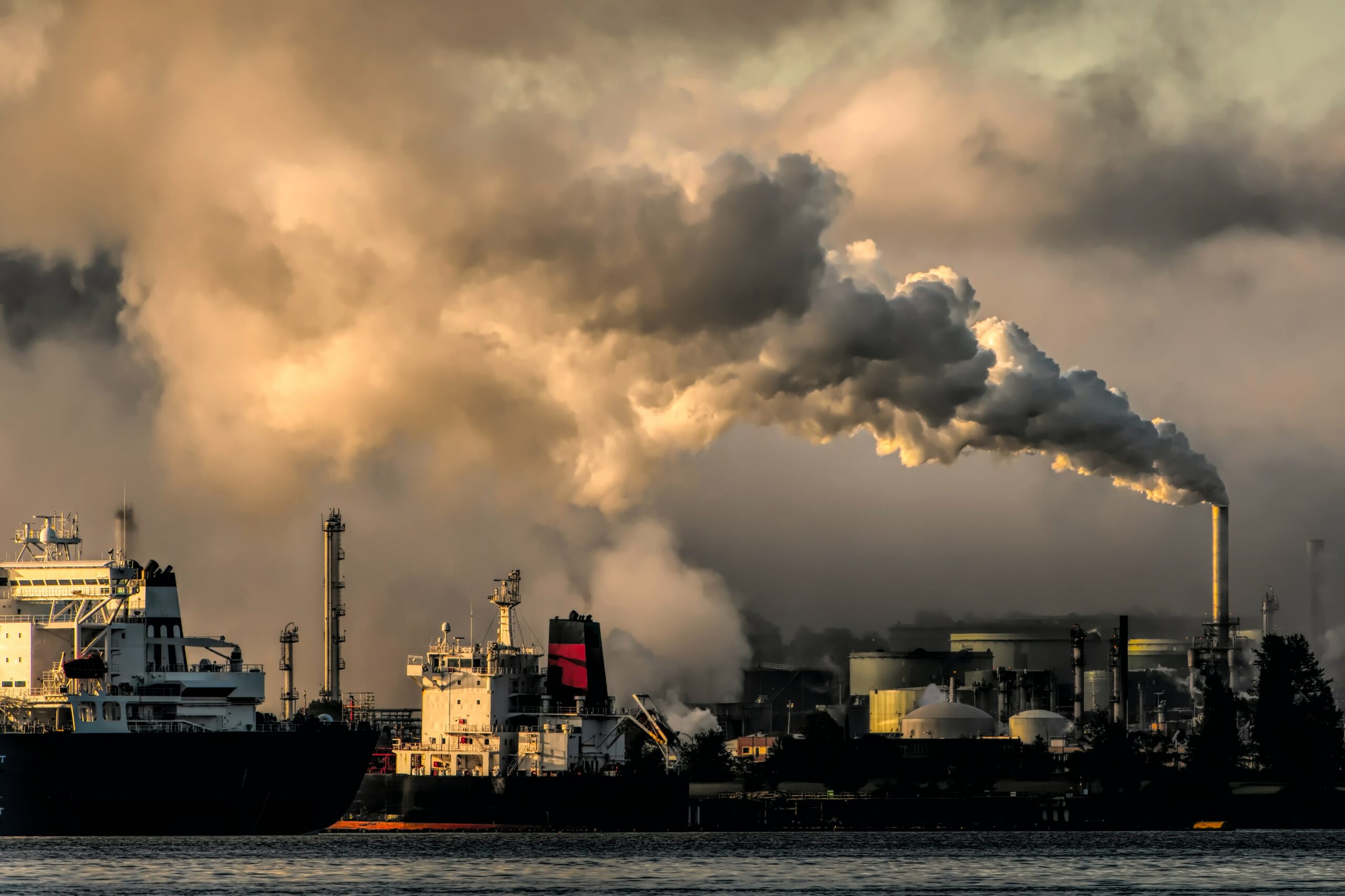 factories in the background with smoke