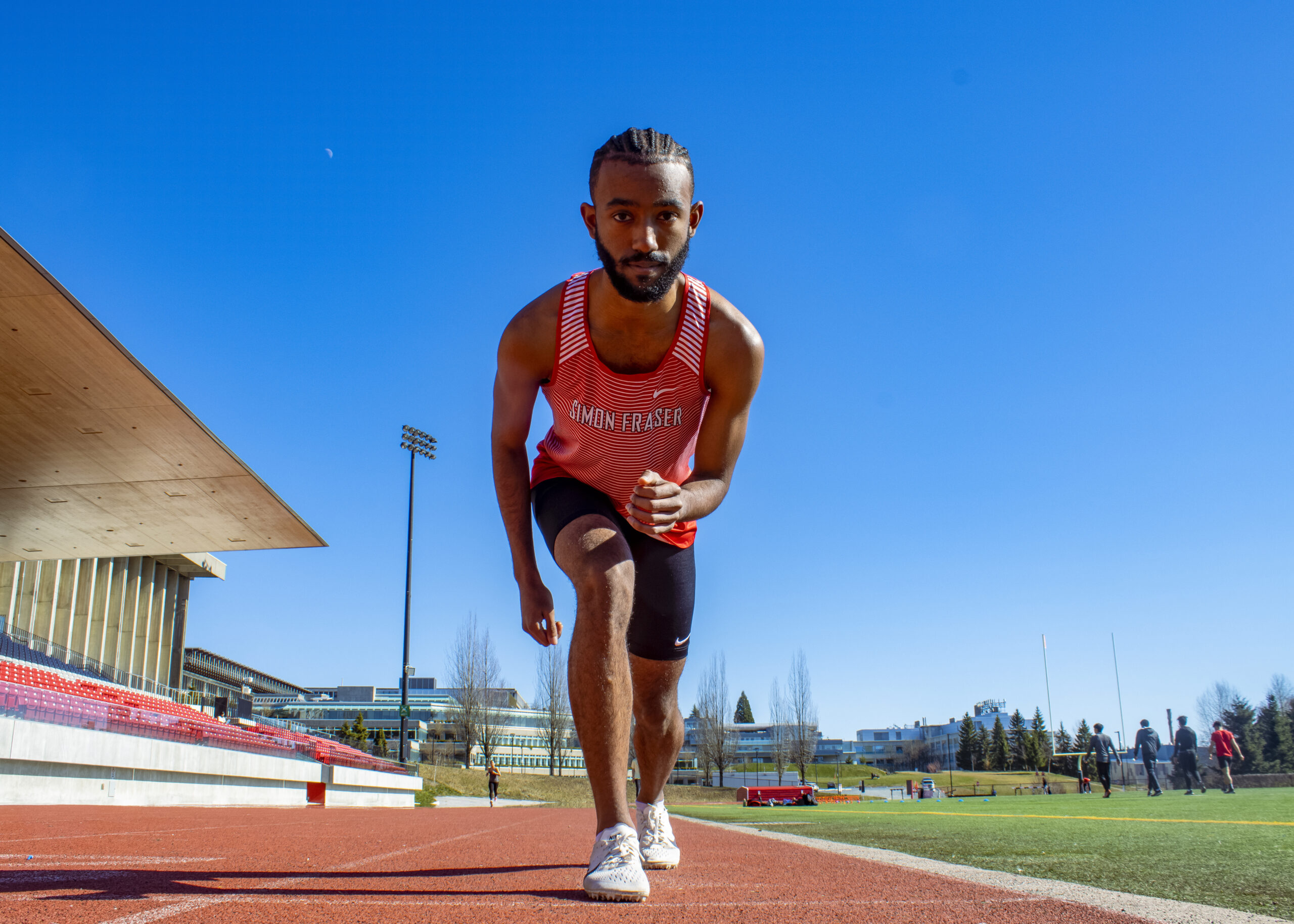 Kirubel Bogale in his starting position on the SFU track.