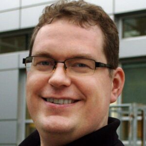 Photos of Gabe Liosis and Corbett Gildersleve standing outside, smiling directly at the camera.