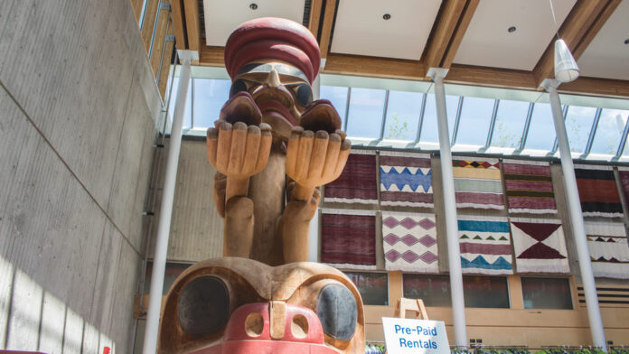 WEB-Aboriginal-Adam-Madojemu Indigenous statue pole in the AQ