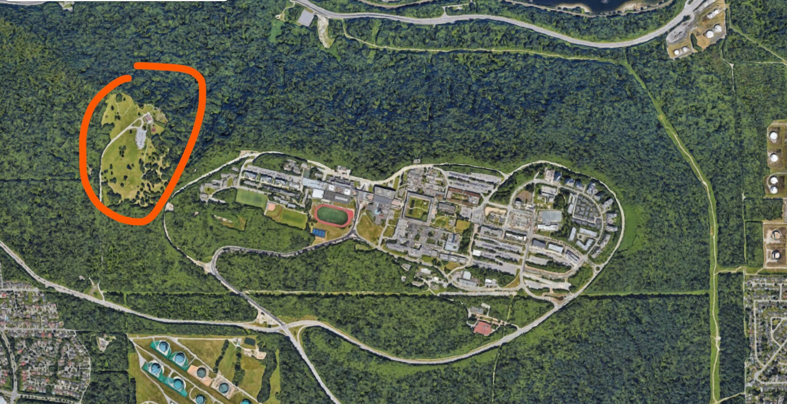 Satellite photo of Burnaby Mountain Conservation Area with parking lot encircled