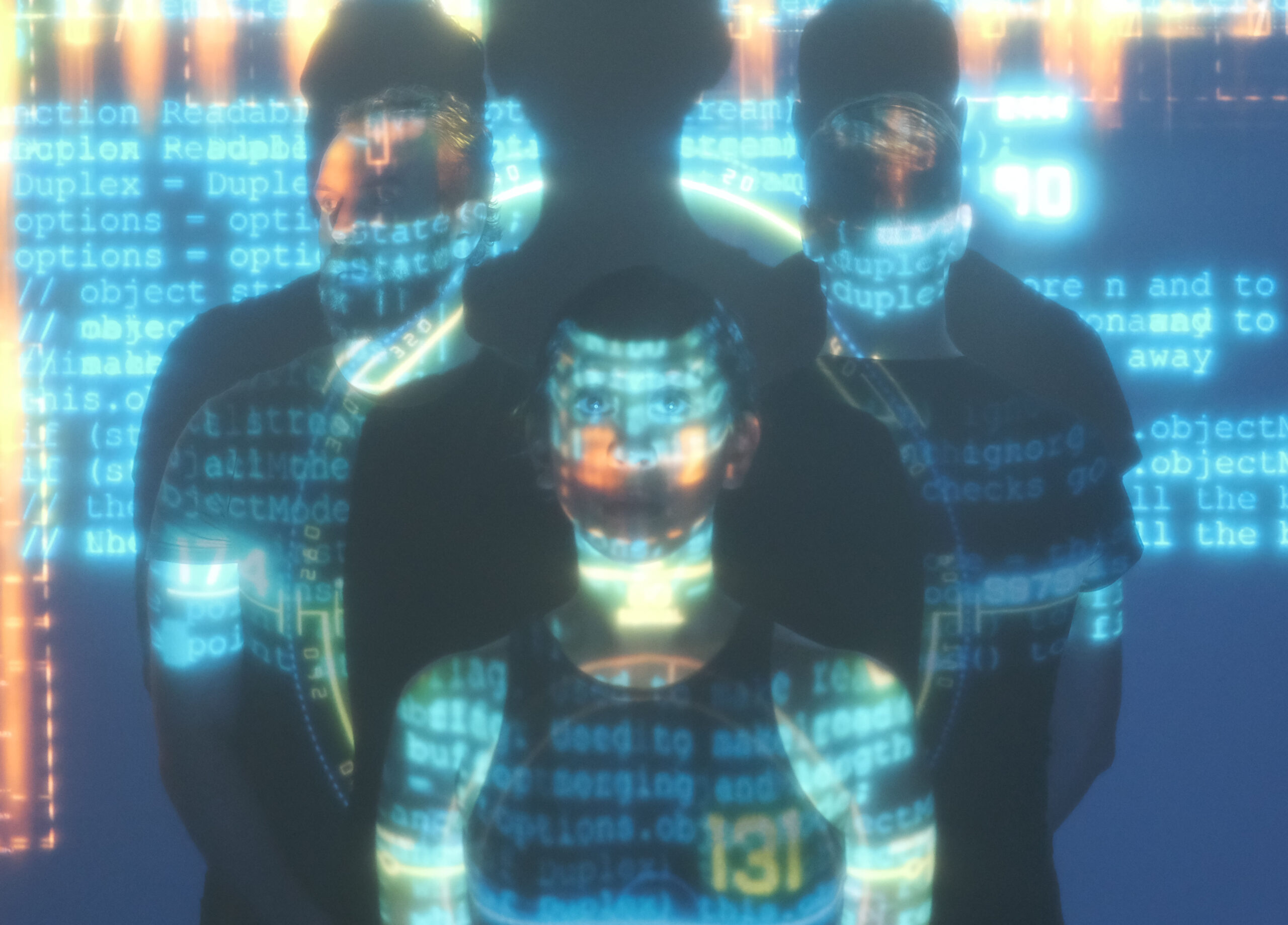 Three people stand facing different directions with blue code projected onto their bodies, and three shadows looming over them above