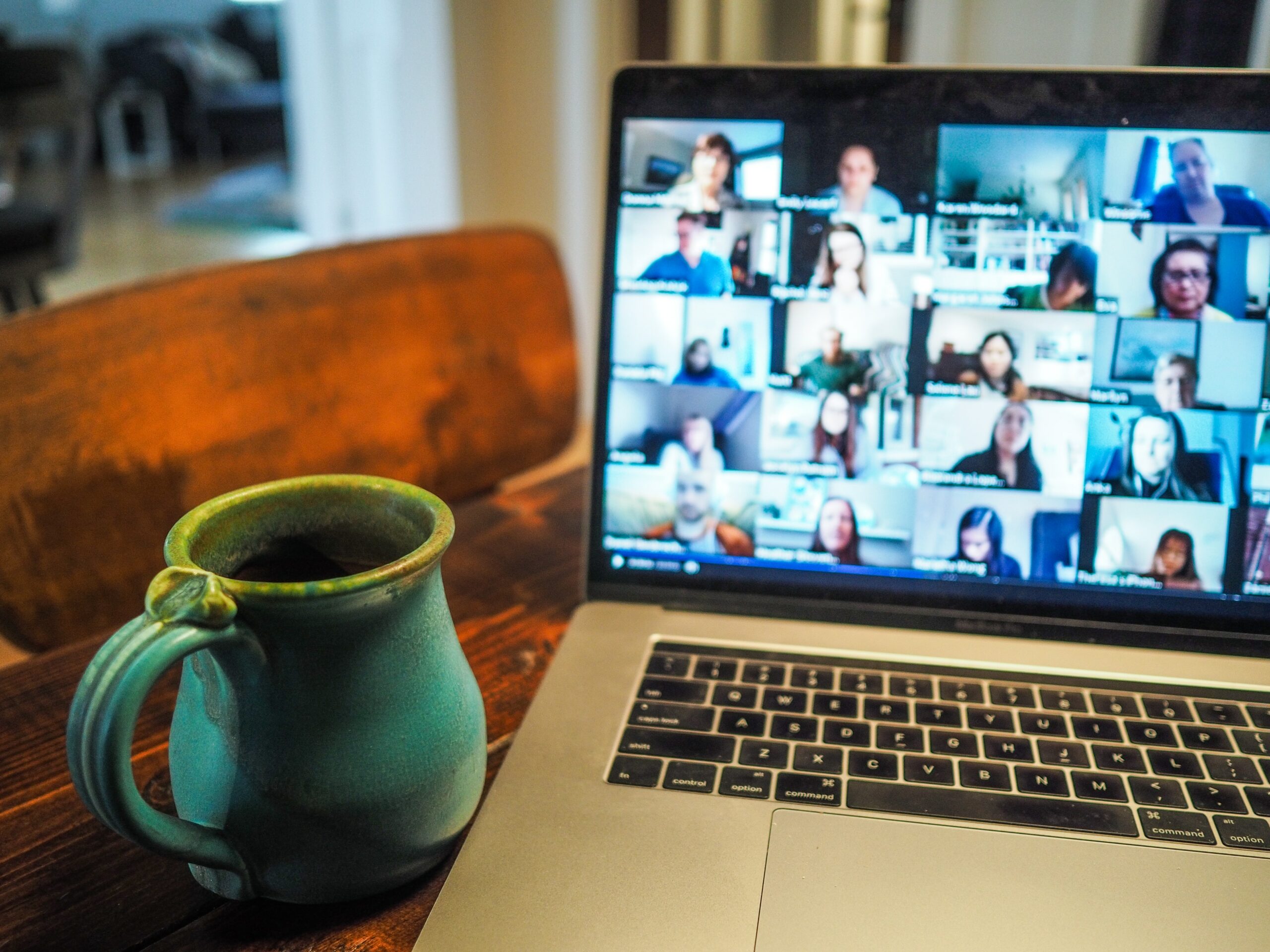 Cup of coffee in front of a zoom meeting