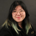 Dear Peakie: She’s got style, she’s got Glee, she has no grace A photo of Humour editor, Kelly Chia, looking very professional and stoic by a wooden bookcase.