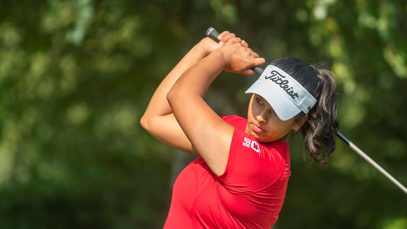Photo of SFU golfer Shirin Anjarwalla mid-swing.