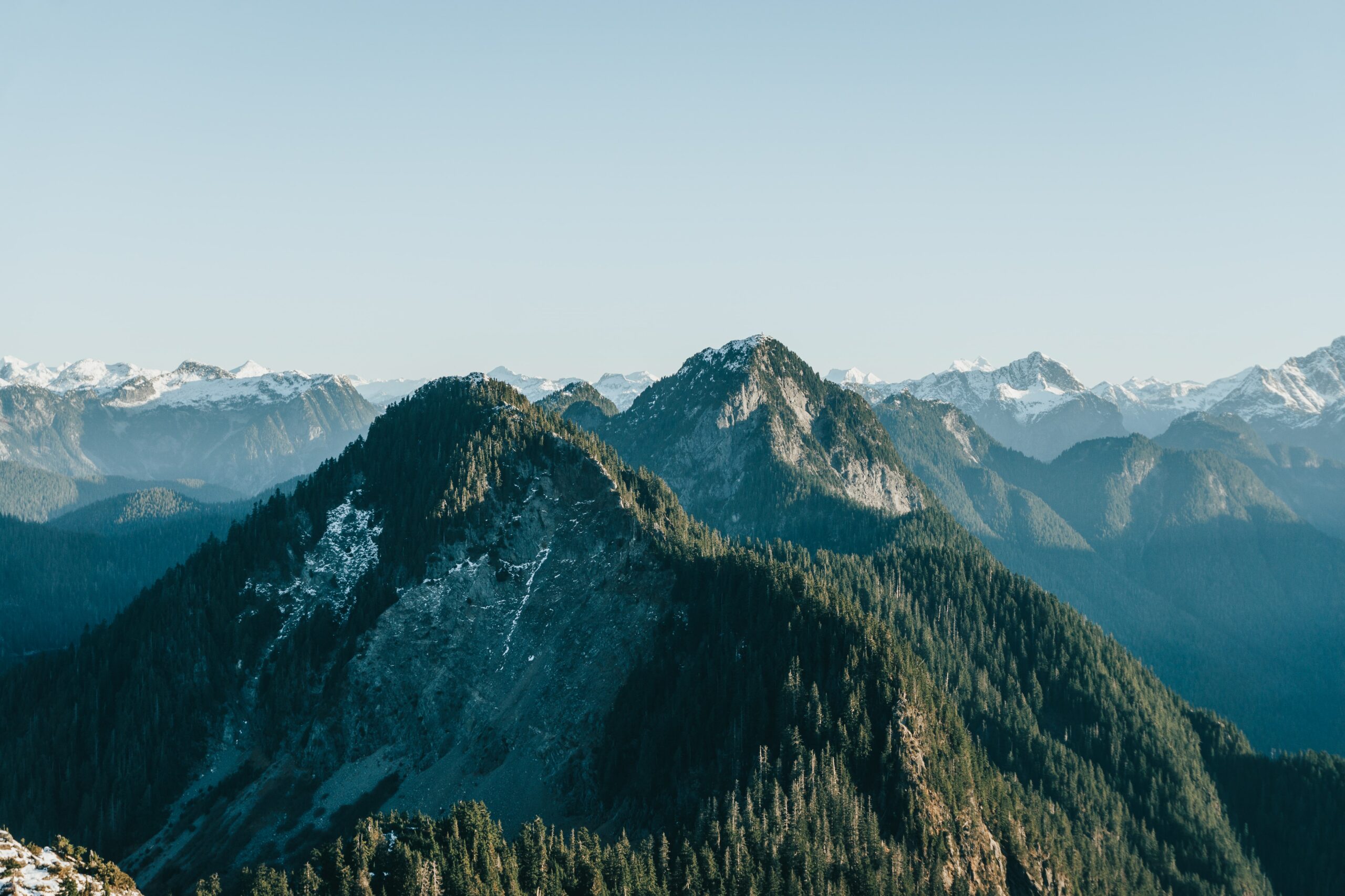 A wide angle photo of the rocky Golden Ears Mountain ridge.