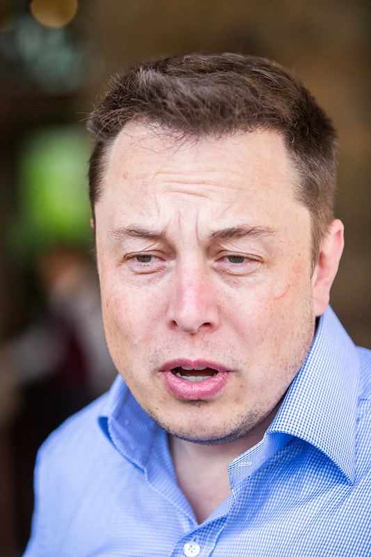 A stock photo of Elon Musk looking confused.