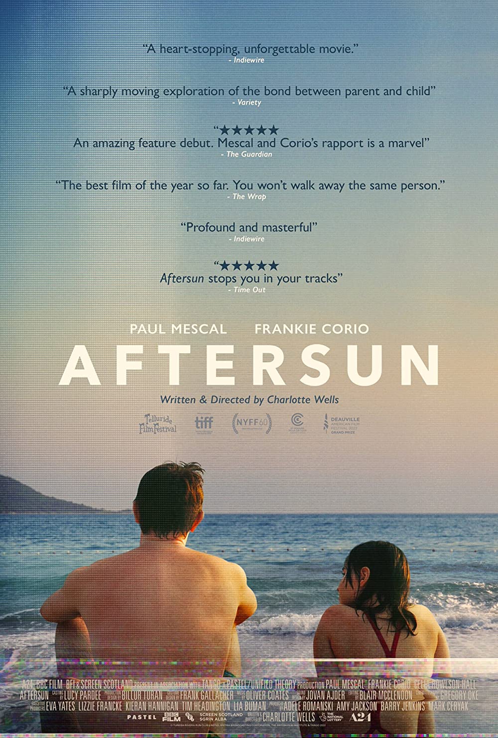 Film cover with a dad and young daughter sitting on a beach looking at the ocean.