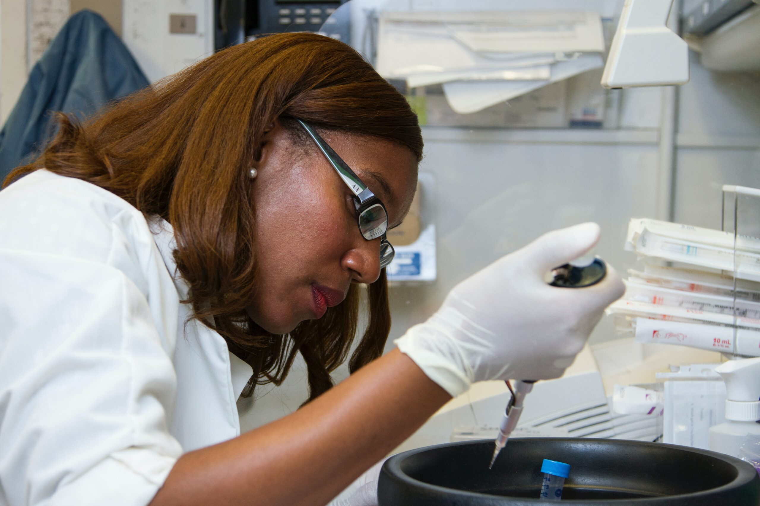 Photo of a woman performing an unidentified task in a laboratory