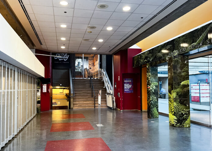 the-study-closed This is a photo of the entrance to The Study pub. At the top of the staircase, the doors to The Study are closed.