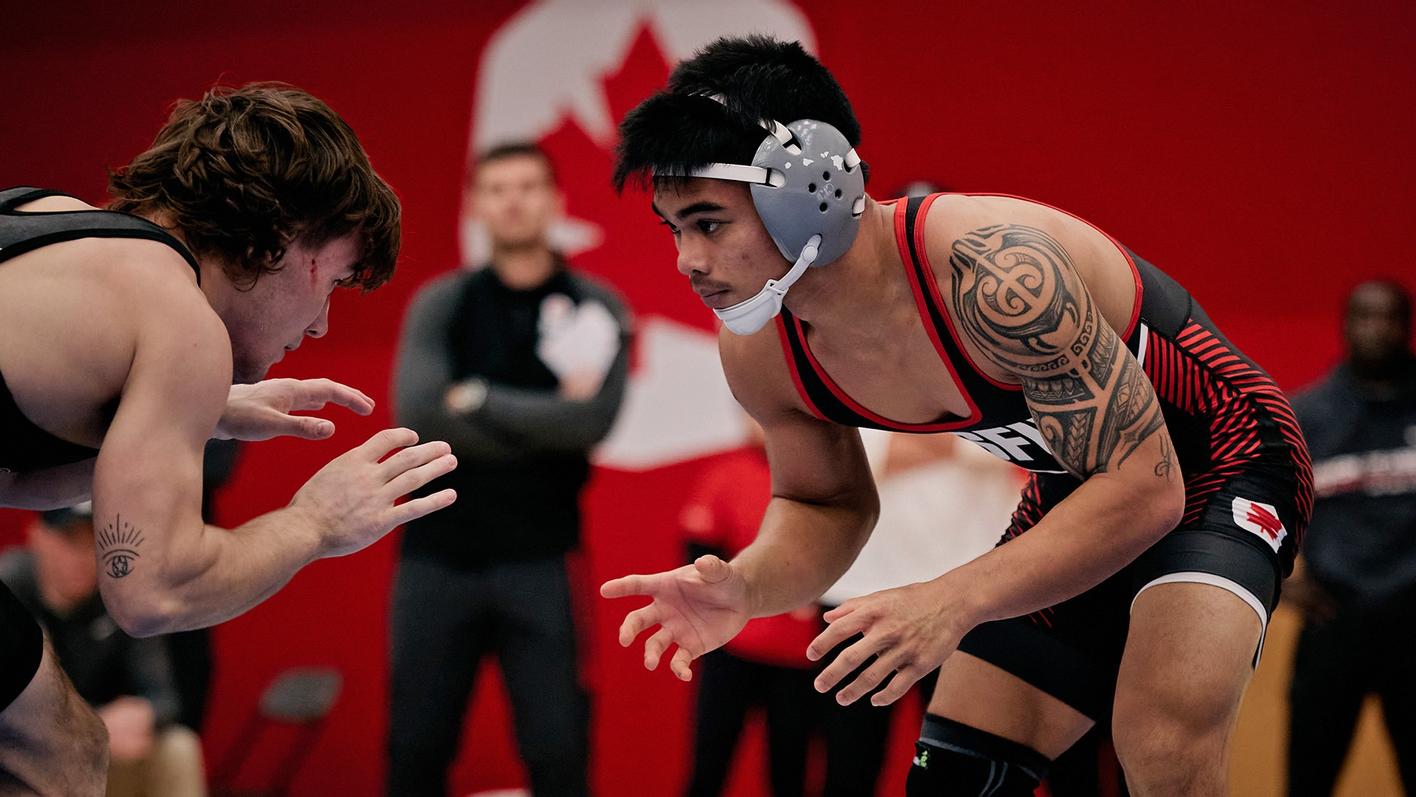 photo of men’s wrestler Maka Yacapin mid-competition.