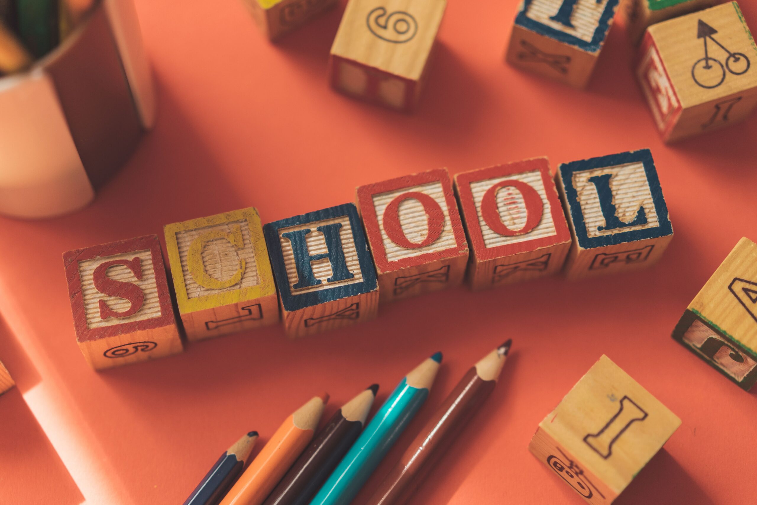 Letter blocks spelling “school”