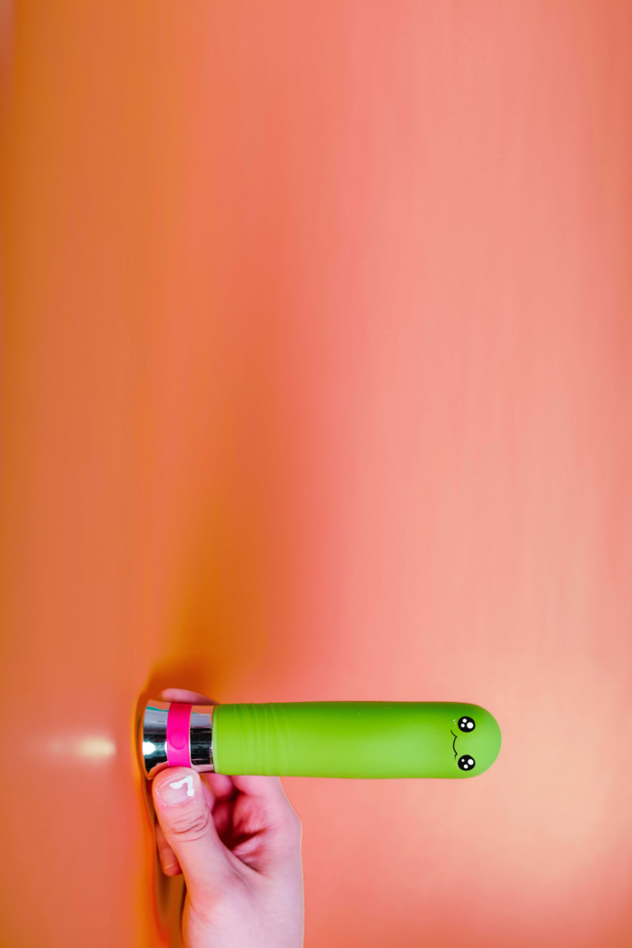 A photo of sex toys, with googly eyes doodled on top.