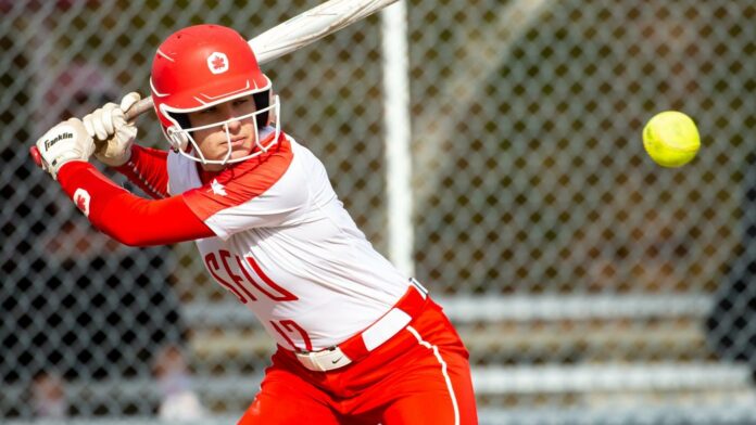 photo of an SFU softball player taking a pitch.