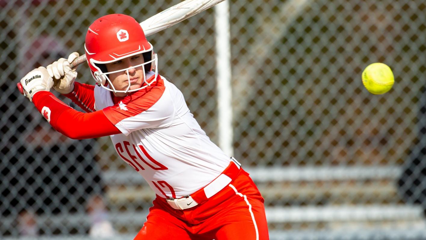 photo of an SFU softball player taking a pitch.