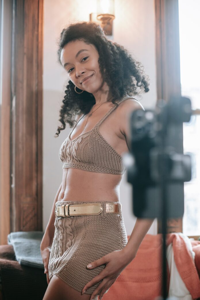 photo of a woman posing in front of the camera.