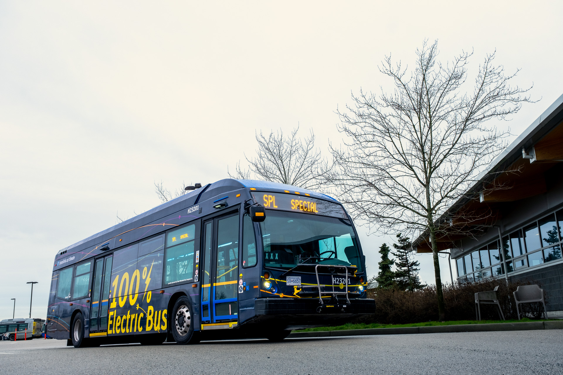 This is a photo of a TransLink bus. The side of the bus says “100% electric-bus”