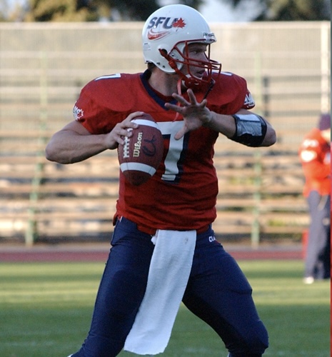 photo of former SFU quarterback J.R. Davies throwing a football during practice.