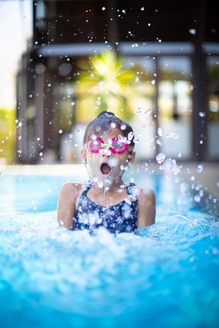photo of a swimmer poking their head above water.