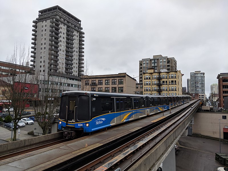 This is a photo of the Skytrain on the Expo Line. The picture is taken of the outside of the train, at an oncoming angle.