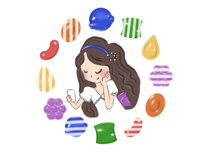 Person holding phone, smiling at the screen, surrounded by candy