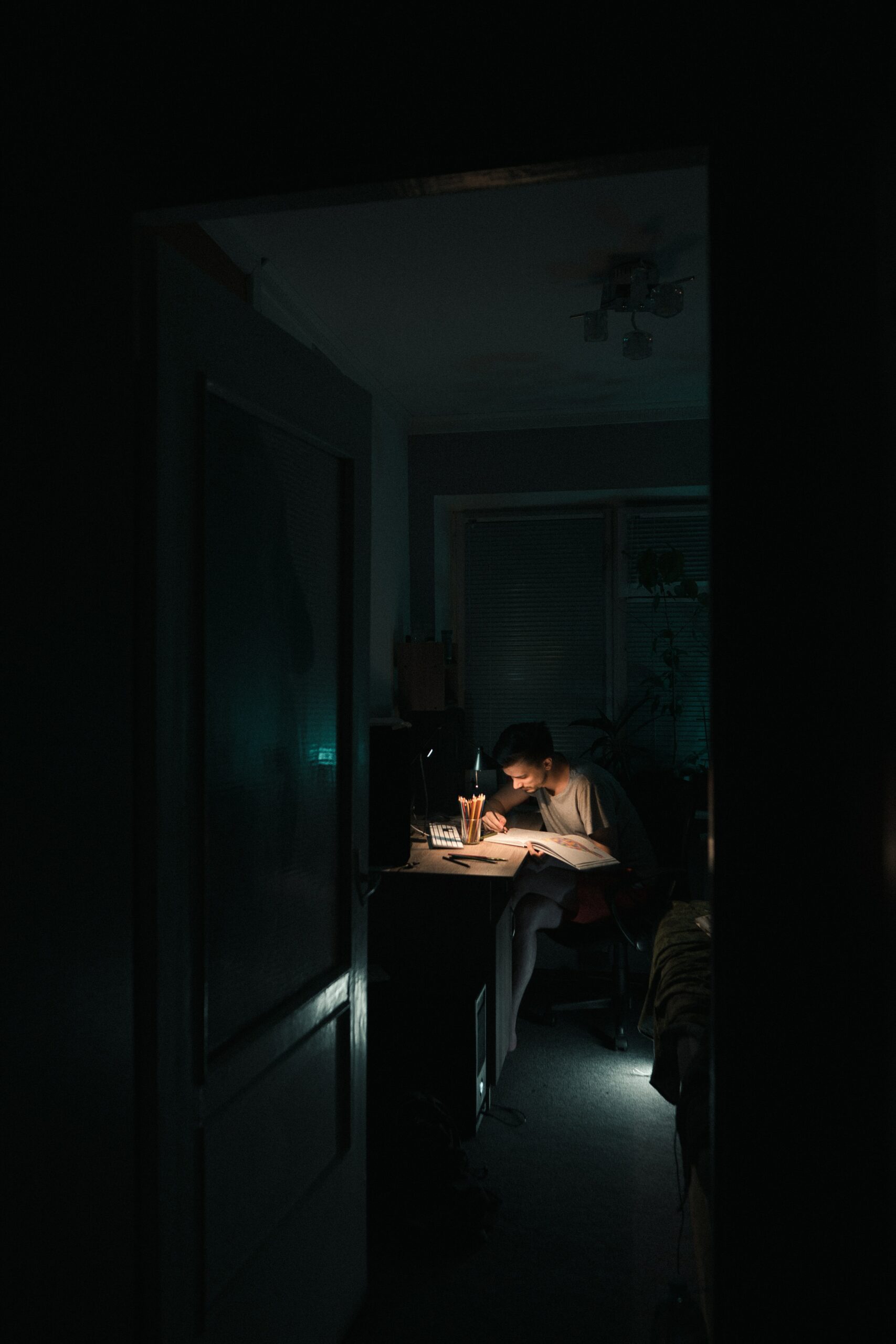 Student studying at a desk late at night