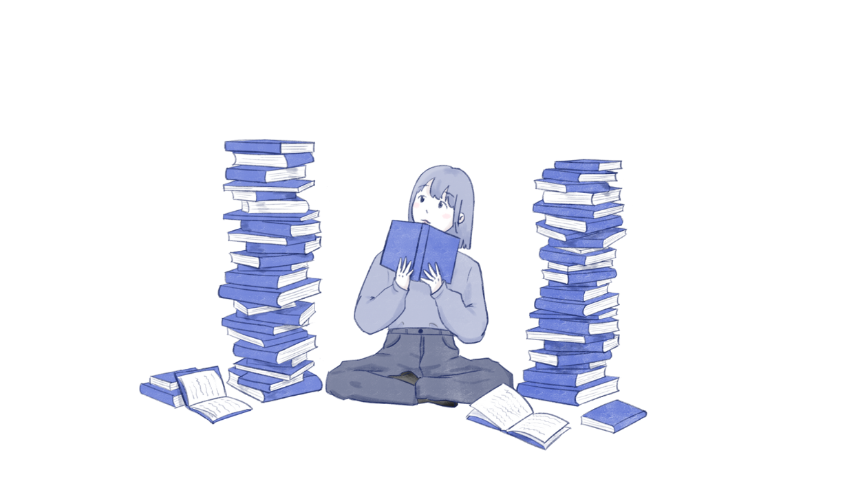 A person sitting criss-cross between two heaping piles of books looking up with an open book in hand