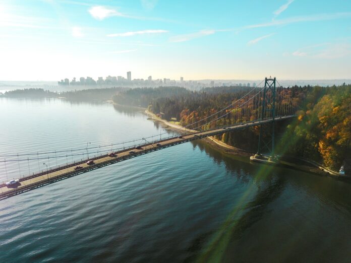 Aerial view of island with Lions Gate Bridge in foreground