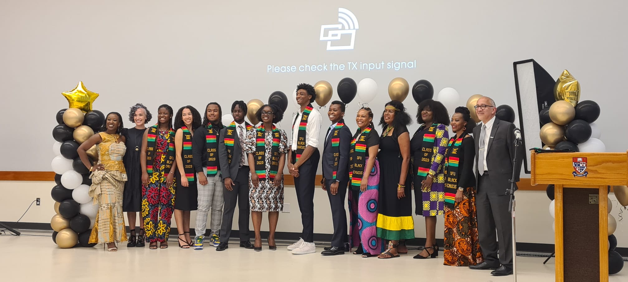 Photographed are the 2023 Black student graduates at the Black Brilliance Graduation Ceremony, depicted with their Kente stoles.