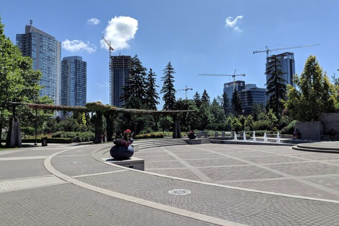 Holland_Park,_Surrey_(20200725_121502) This is a photo of Holland Park. The park has stone courtyard, surrounded by grass and trees.