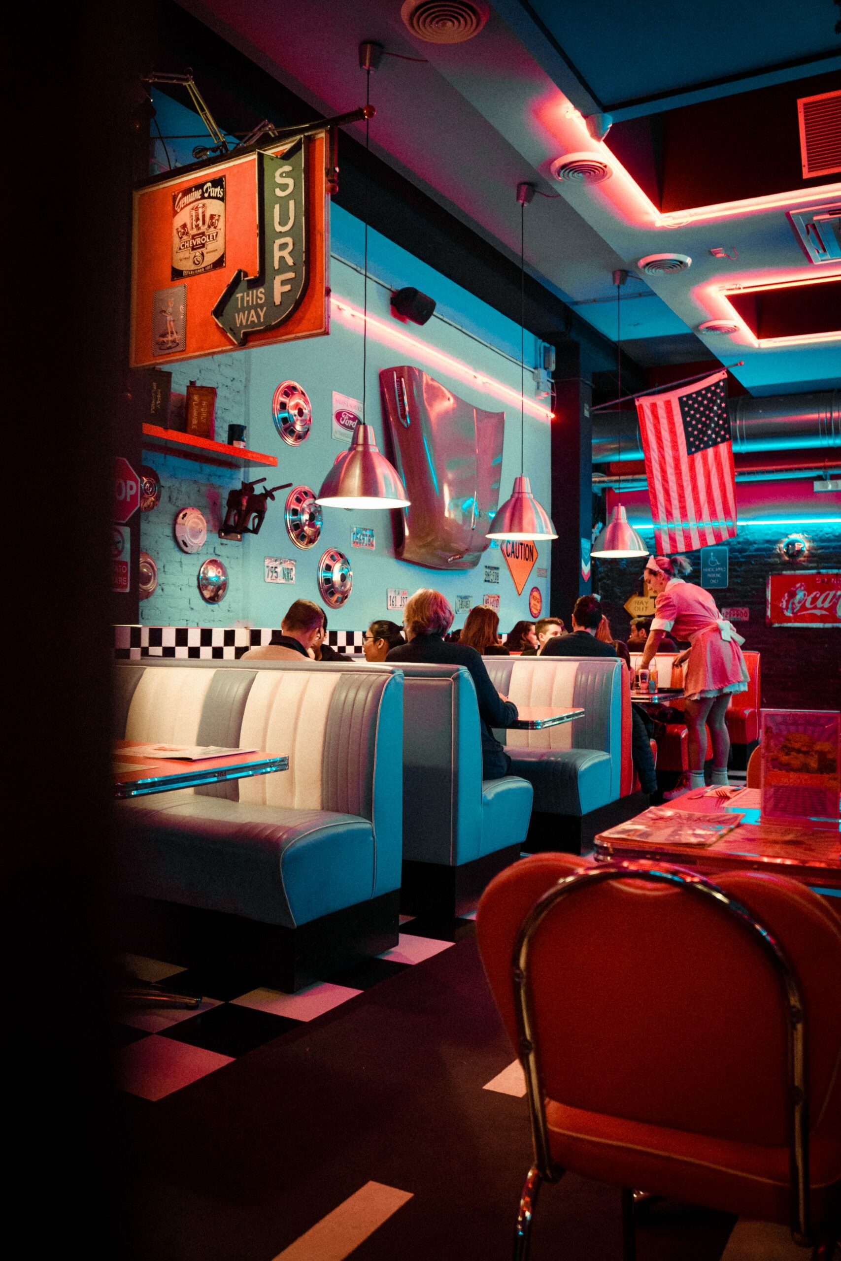 People eating at a 50s-themed diner.