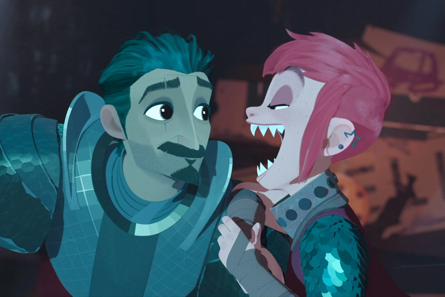 An animation from Nimona featuring Nimona and Ballister. Nimona, with short red hair and a star earring on the top of her ear, is grinning wide with shark-like teeth, looking at Ballister. Ballister, who has short black hair, a mustache, and bear, is looking proudly at Nimona. They are both wearing armor.