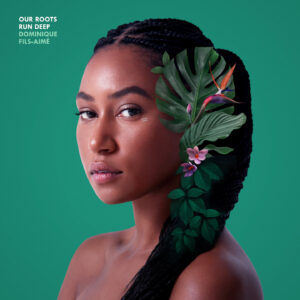 Our roots run deep by Dominique Fils-Aimé features a closeup of Fils-Aime with dark green leaves in her braided, slick-back hair in front of a green backdrop.