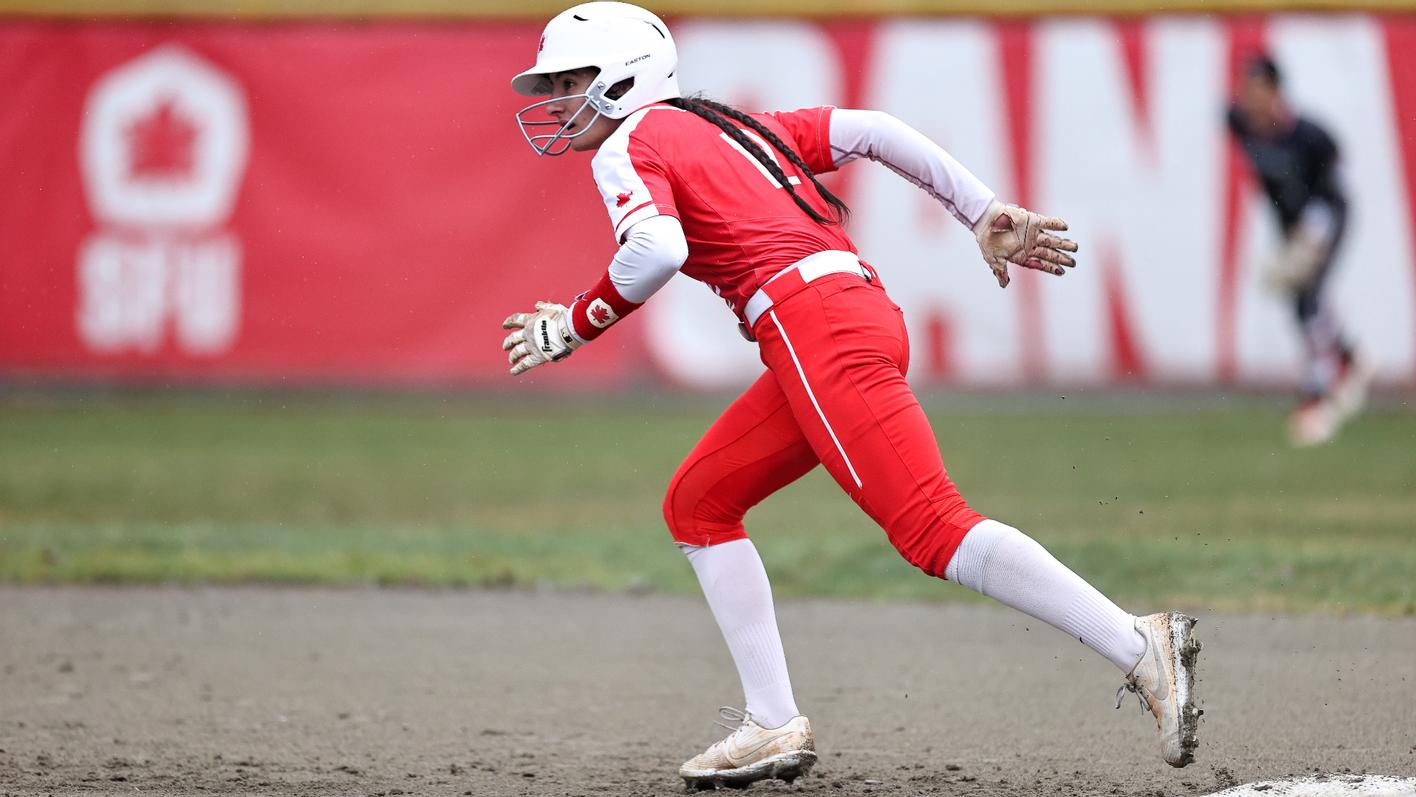 photo of an SFU softball player running the bases.