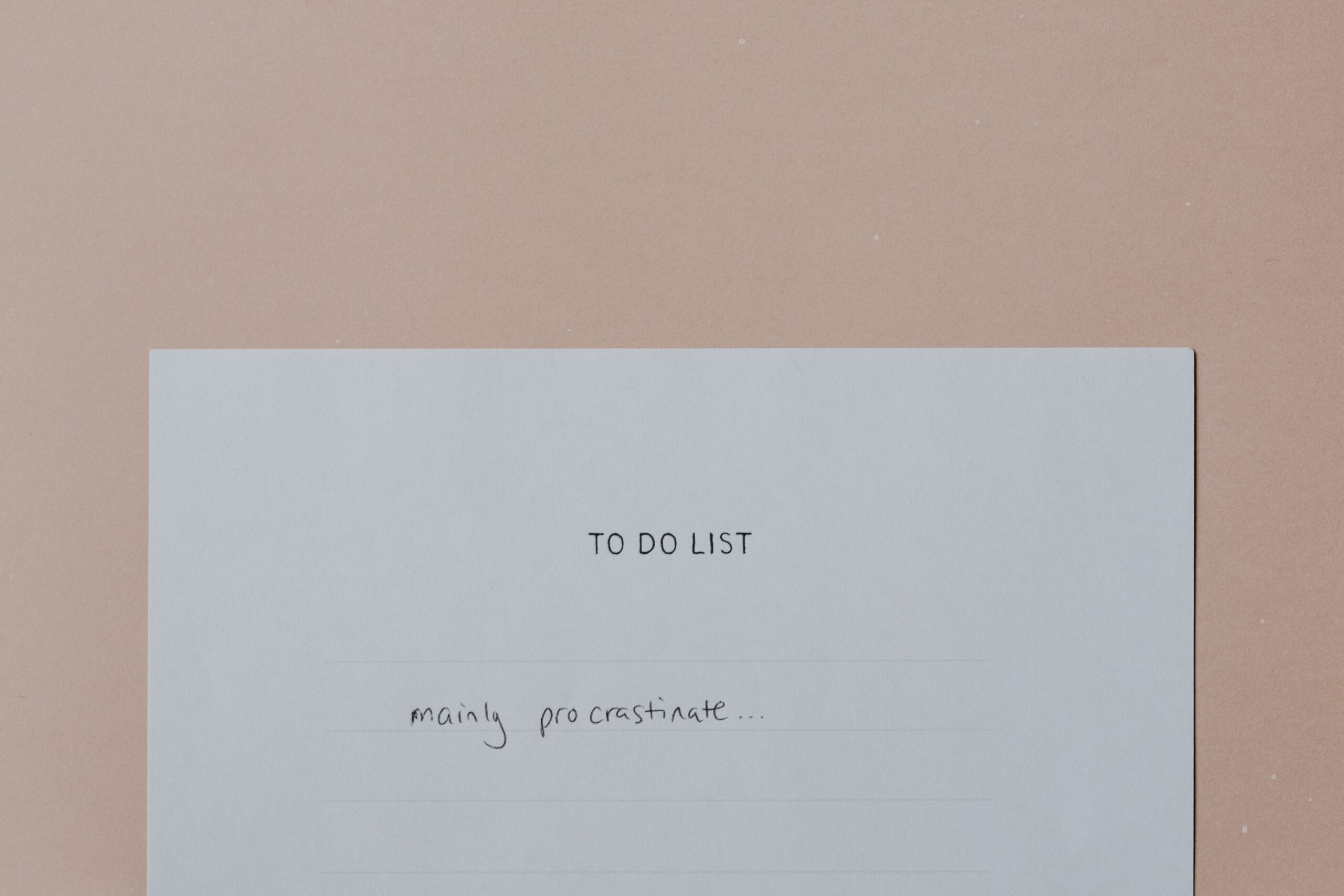 A piece of white paper with a heading saying “To Do List” and one item stating “Mainly procrastinate”