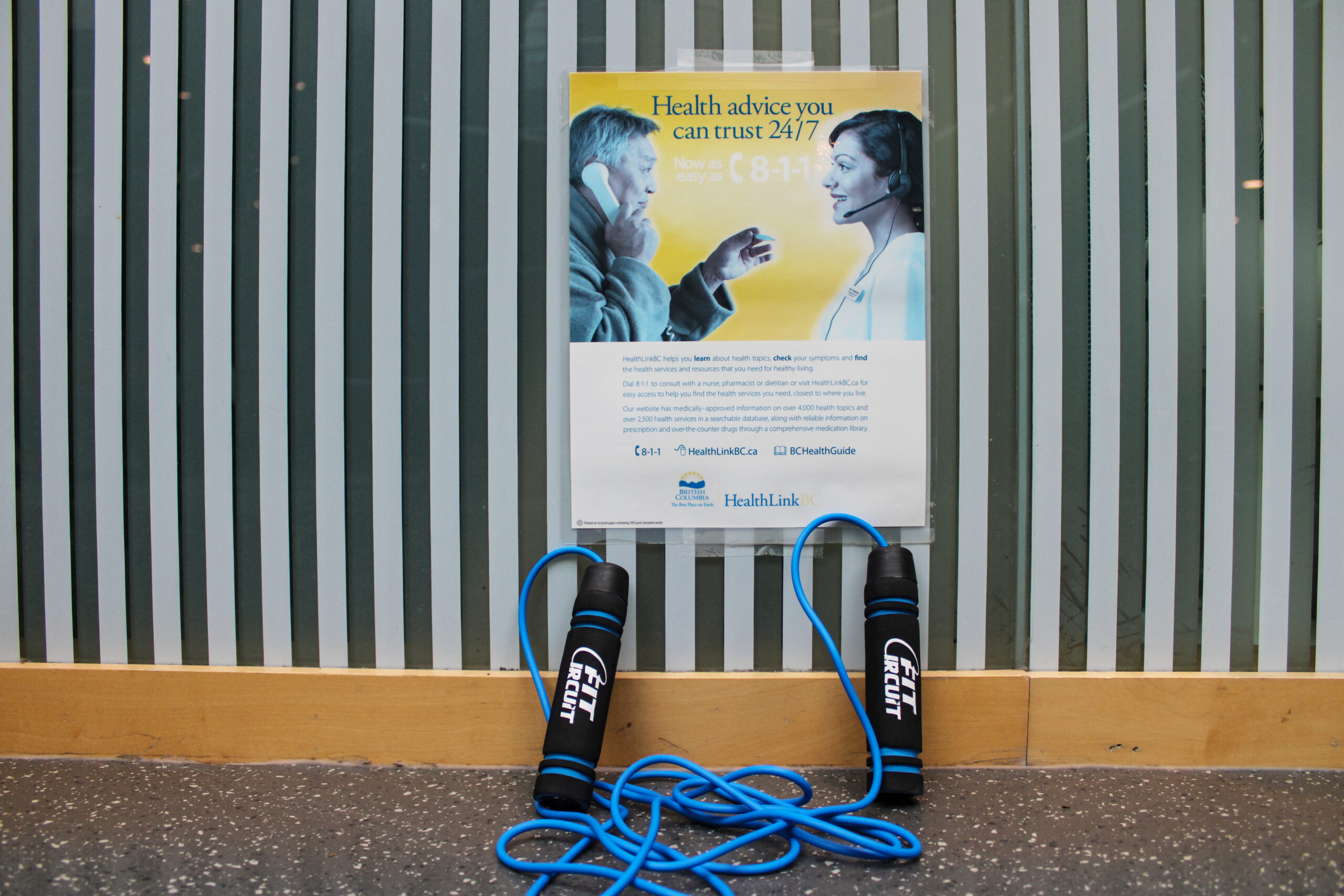 photo of a jump rope placed in front of a mental health resource poster.