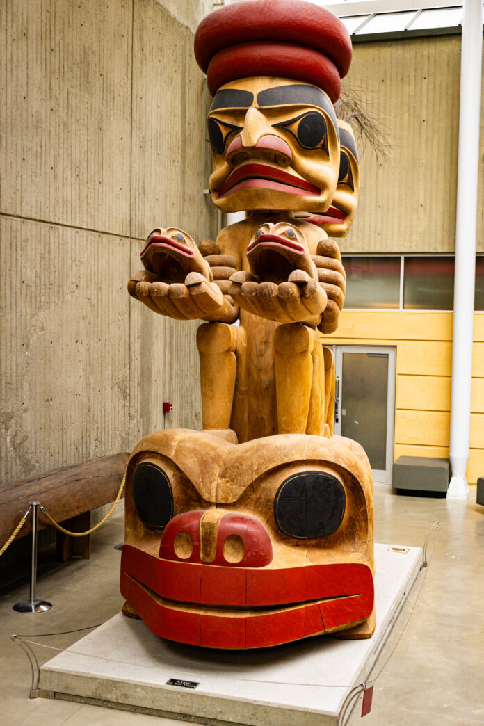 A photo of the frog constellation cedar sculpture.