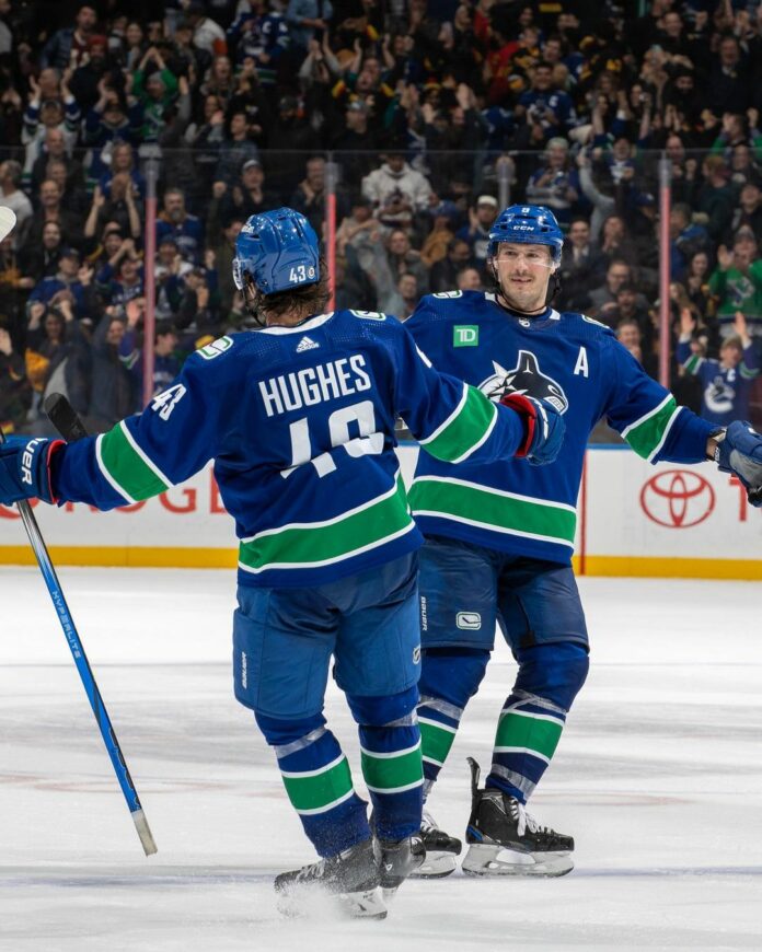 canucks-ig photo of Quinn Hughes and JT Miller celebrating after Hughes’ OT game winner.
